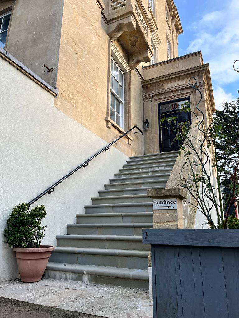Sefton Park outside - a staircase leads to the front door of the building. The building is a large historical sandstone building.
