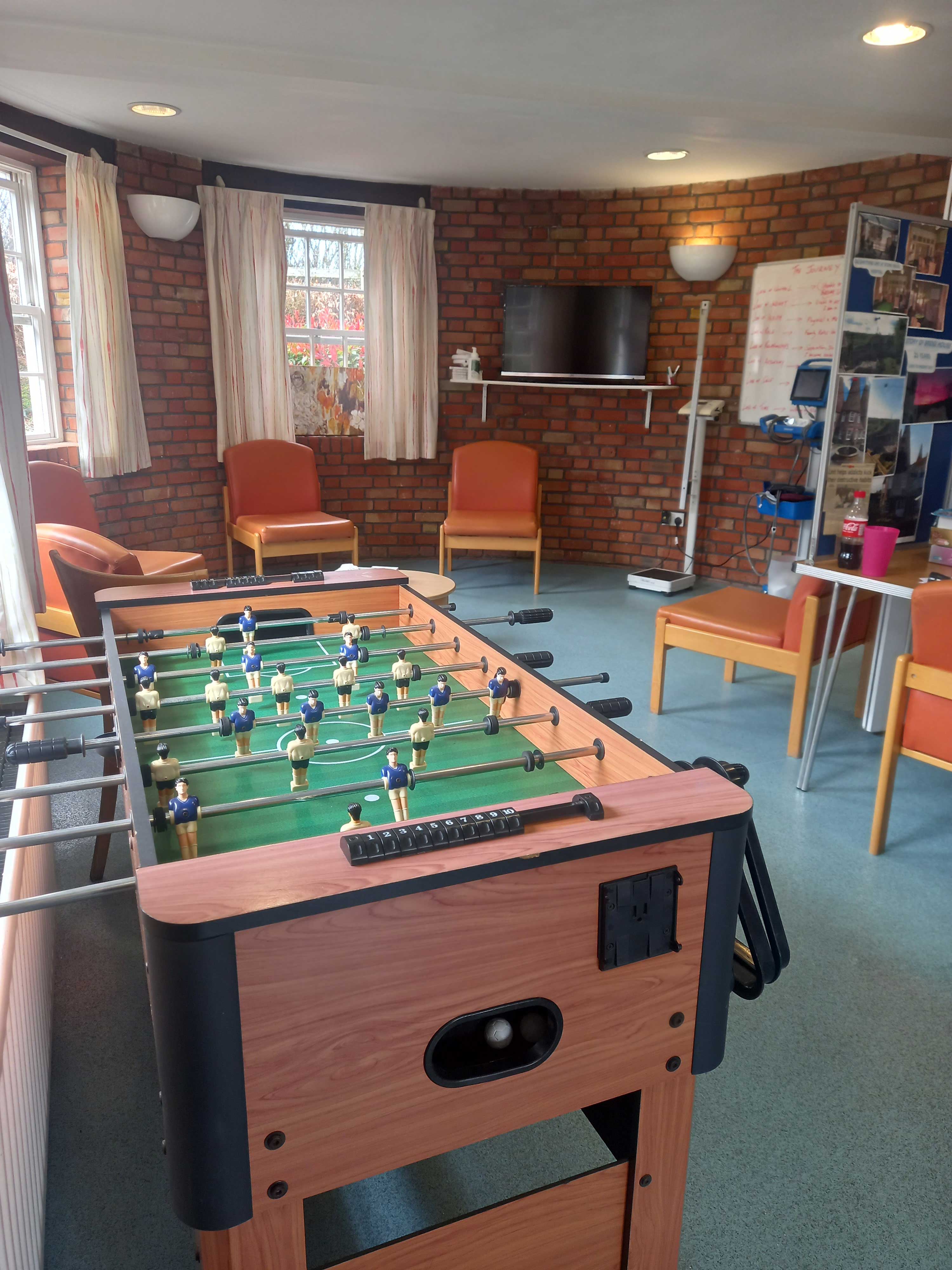 A games room with a football table