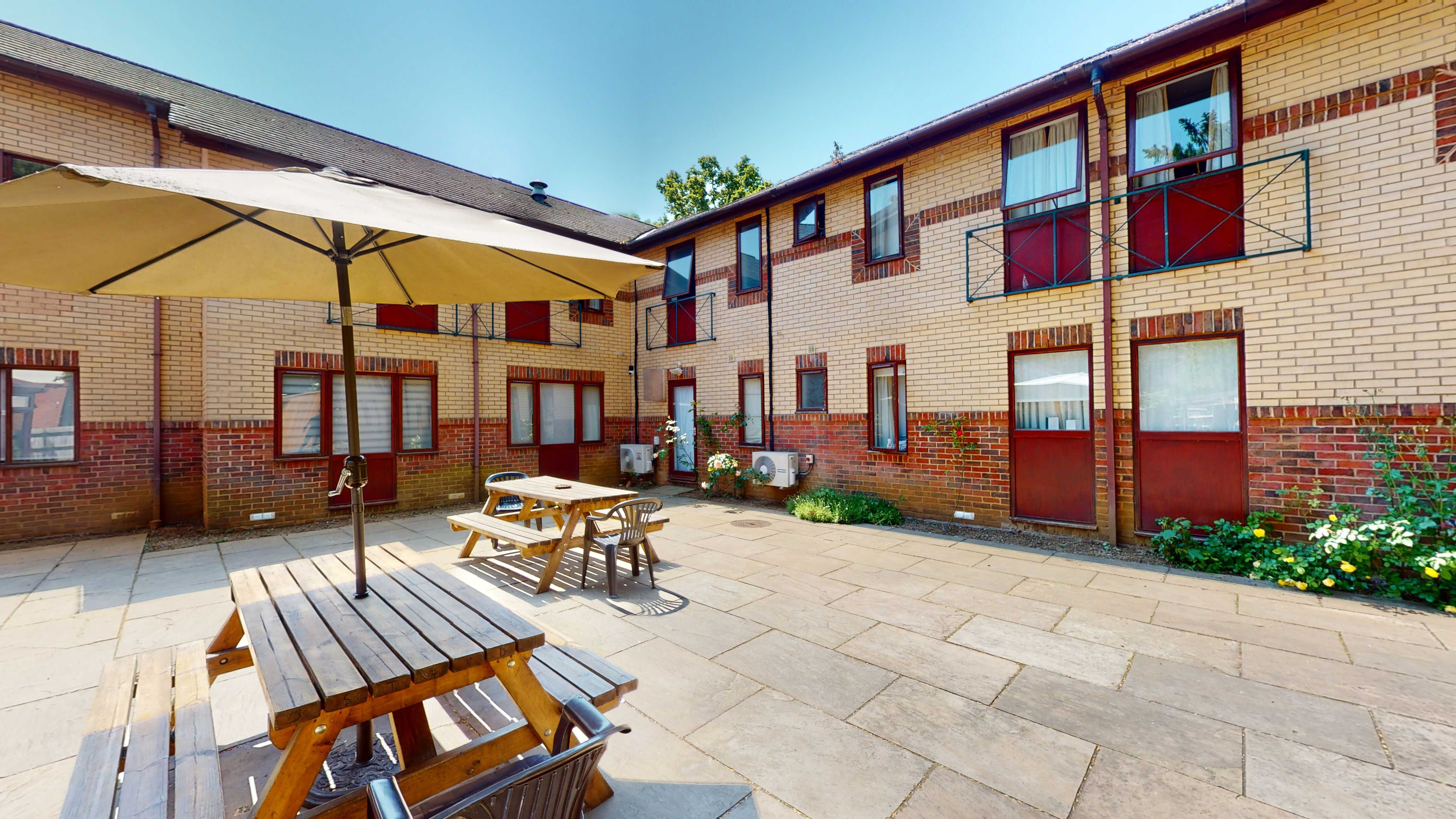 A courtyard area with picnic benches