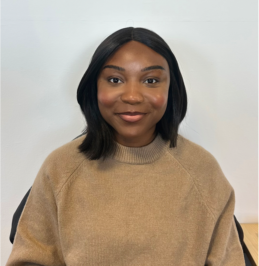 A young Black woman with shoulder length black hair