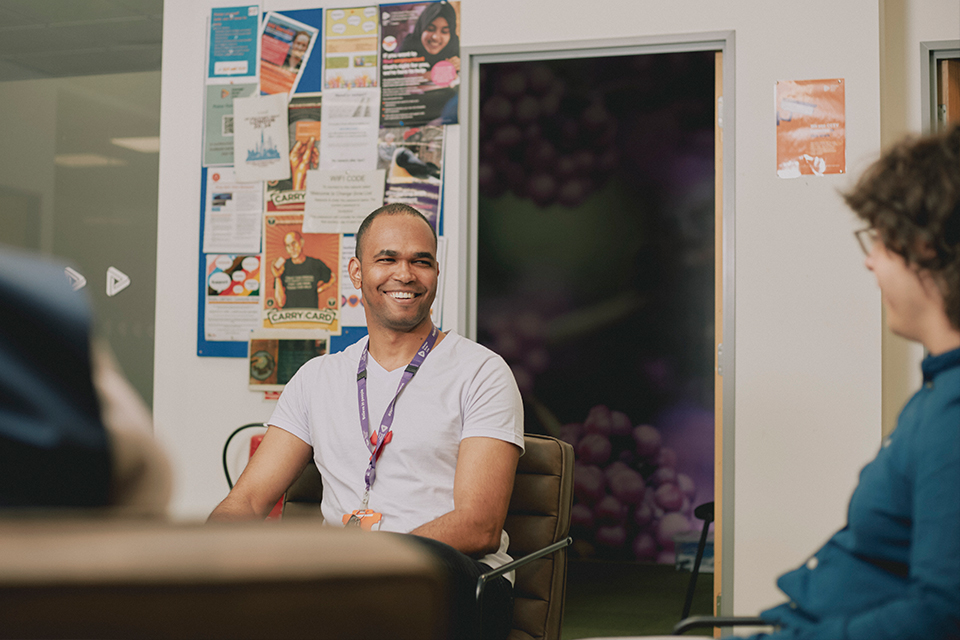 Two colleagues chat in a local Change Grow Live service
