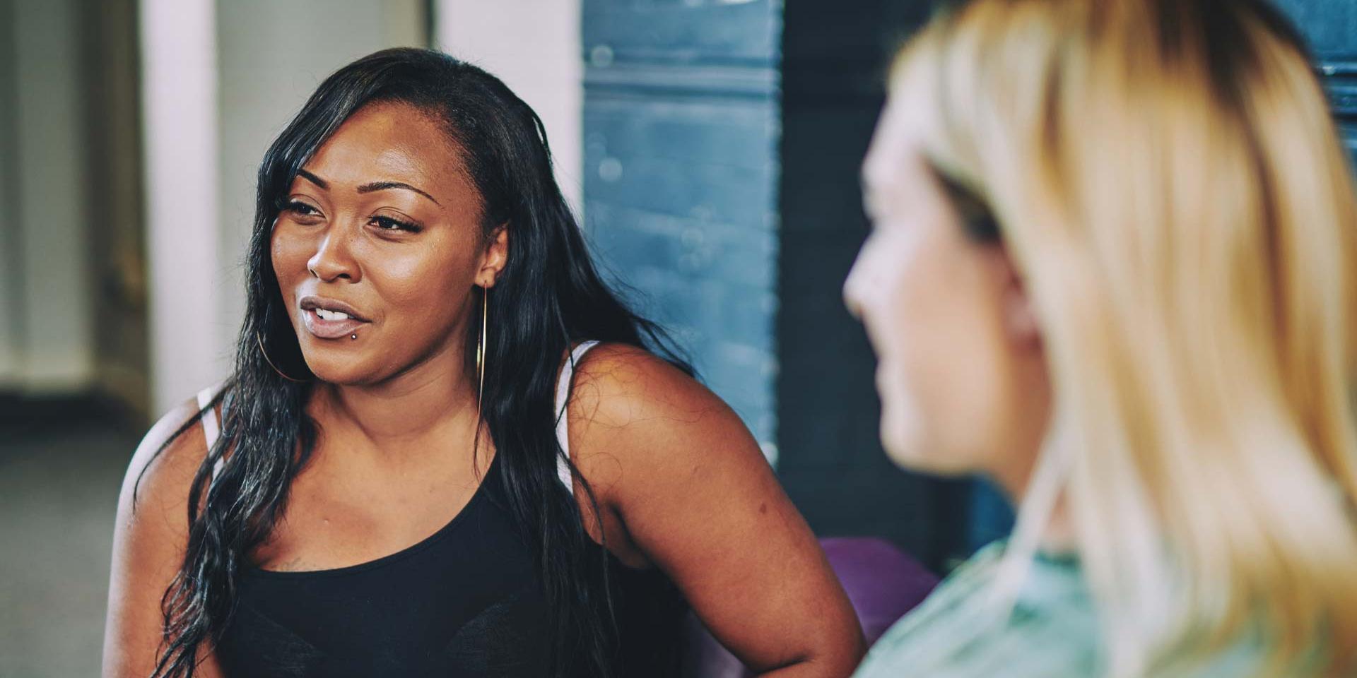 a woman looking off to the distance while talking
