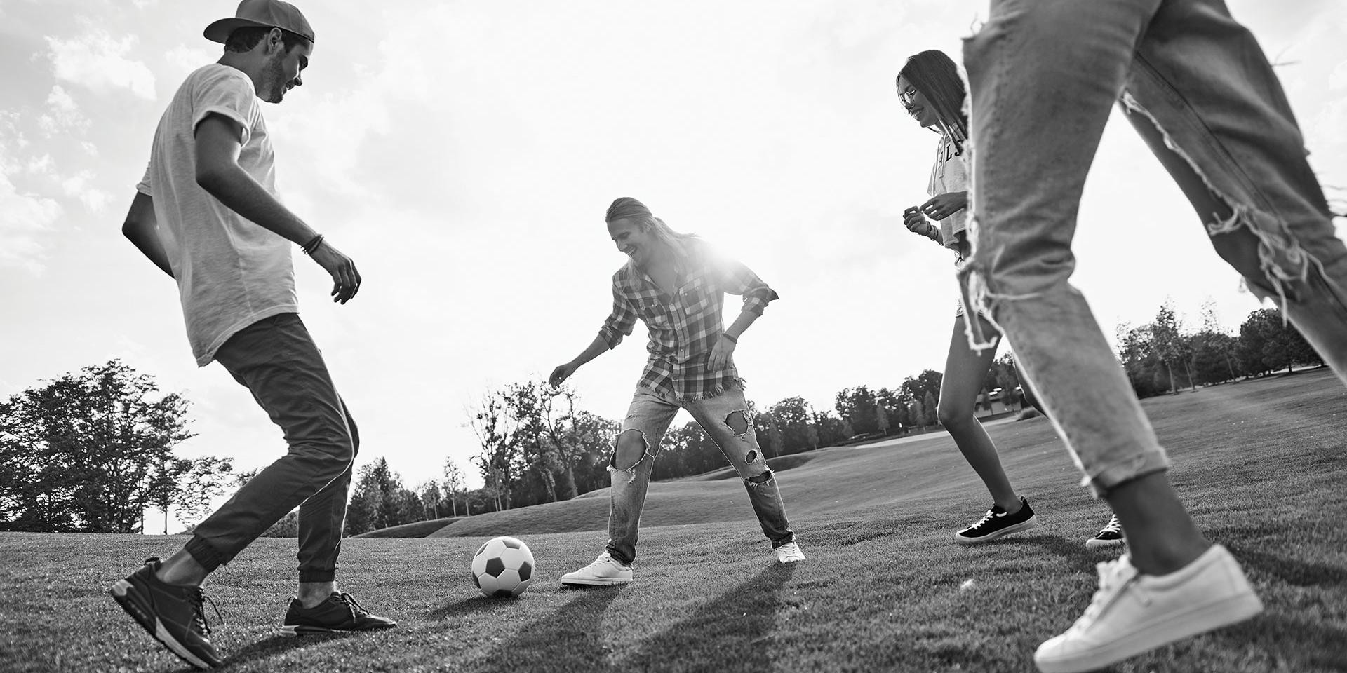 Young people playing football