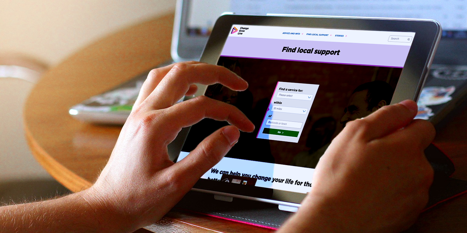 person using this website on a tablet - title of the page is 'Find local support''