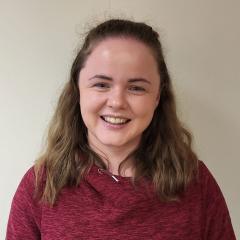 A woman wearing a red jumper