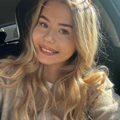 Megan has long blonde hair