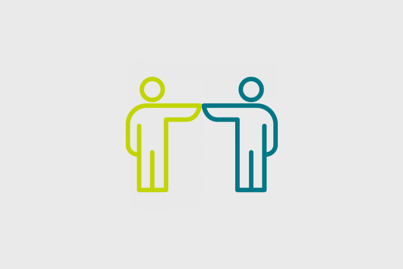 Two outlines of people holding hands
