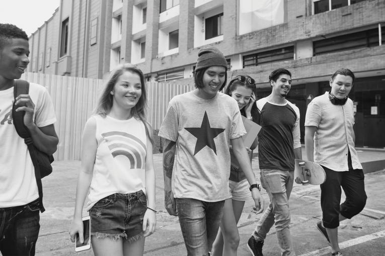 Group of young people walking together