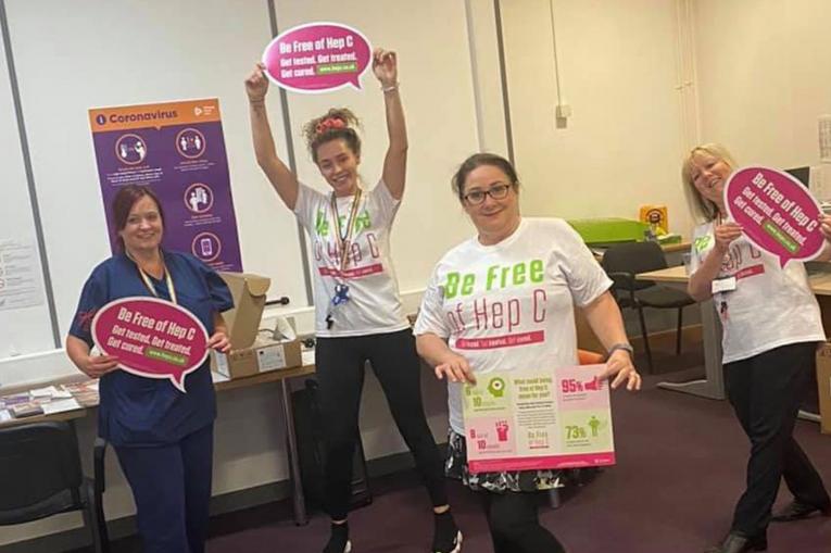 The St Helens Team holding Be Free Of Hep C signs