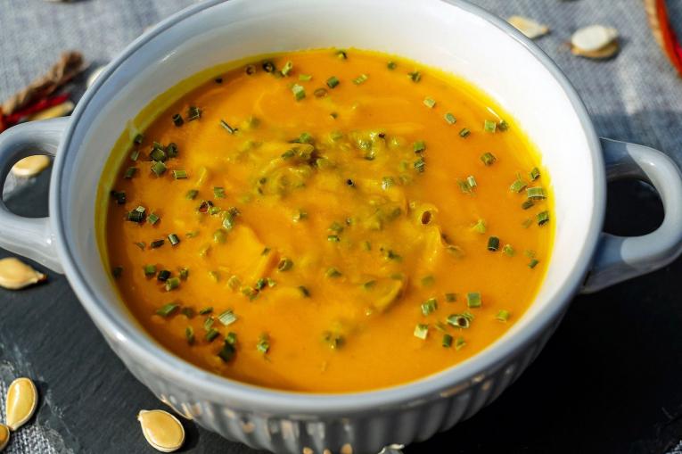 A photo of a bowl of pumpkin soup