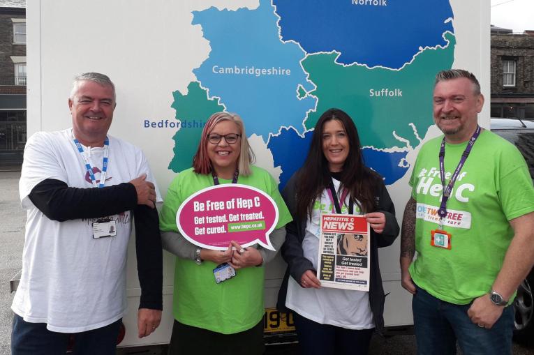 A photo of staff in front of the Hep C testing bus