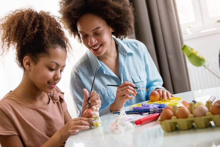 A woman and a child doing a craft activity