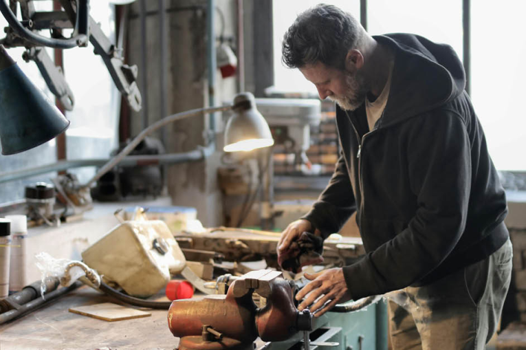 A man doing woodwork in a workshop