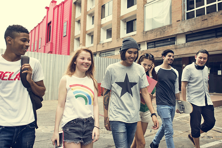 Group of young people walking and talking