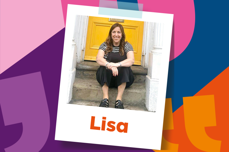 Lisa is sitting on steps outside a yellow door