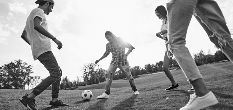 Young people playing football