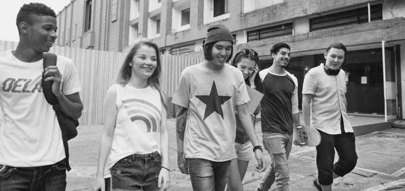 Group of young people walking together