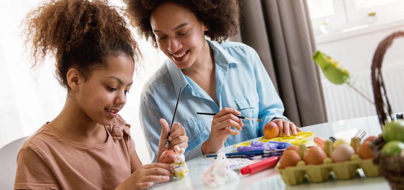 A woman and a child doing a craft activity