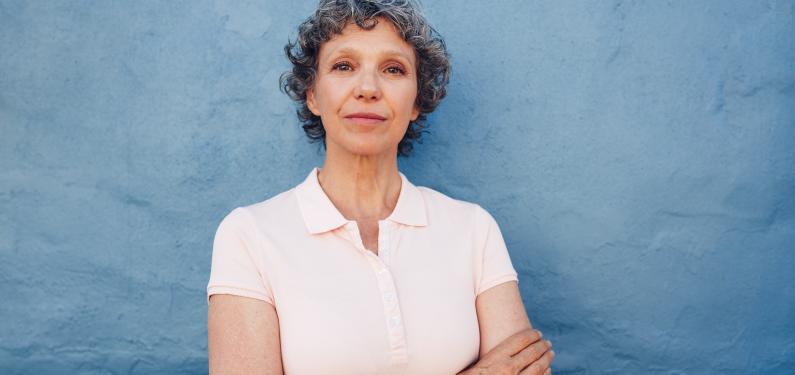 An older lady with short curly greying hair