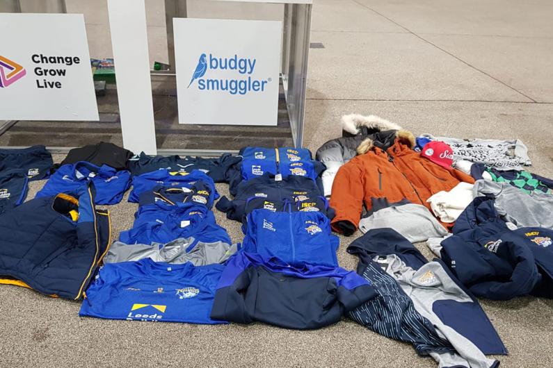 Photos of the rugby kit folded on the floor