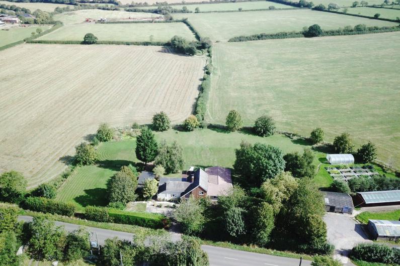 An aerial view of ESH community - the building and grounds are surrounded by fields and trees