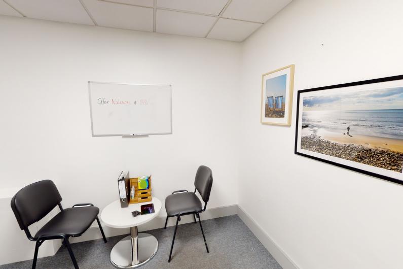 Washington Health Centre - Group room - two chairs facing one another, white walls and painting